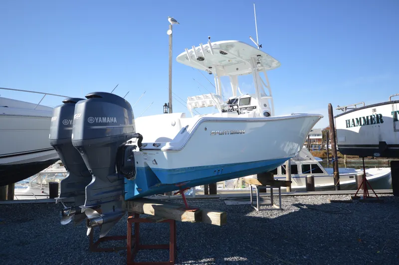 Slide: The Image of 2015 Sportsman 25 Center Console boat with twin Yamaha engines on display. - 3
