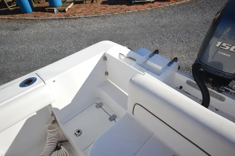 Slide: The Image of 2015 Sportsman 25 Center Console boat interior with Yamaha 150 engine. - 30
