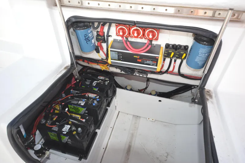 Slide: The Image of 2015 Sportsman 25 Center Console boat electrical system and battery compartment. - 33