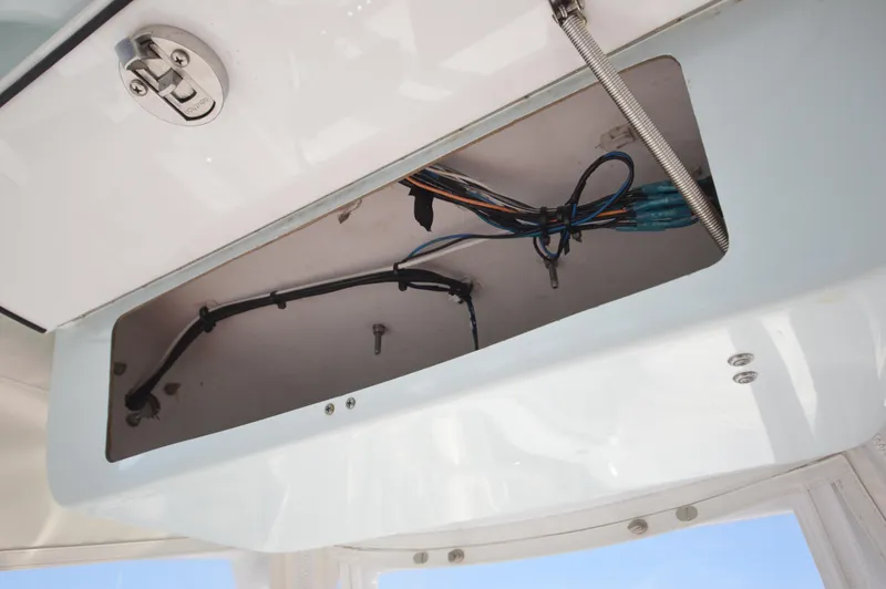 Slide: The Image of 2015 Sportsman 25 Center Console boat wiring compartment. - 34