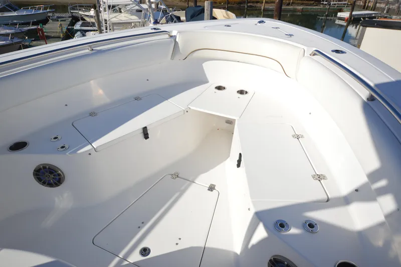 Slide: The Image of 2015 Sportsman 25 Center Console boat with spacious seating and storage compartments. - 7