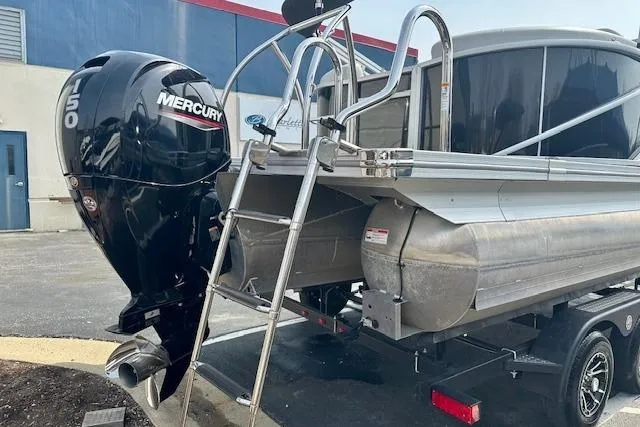 Slide: The Image of 2022 Barletta Corsa 21QC pontoon boat with Mercury outboard motor and ladder. - 16