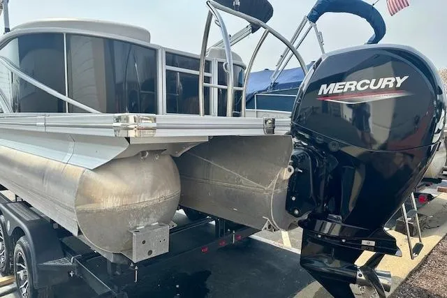 Slide: The Image of 2022 Barletta Corsa 21QC pontoon boat with Mercury outboard motor on trailer. - 17