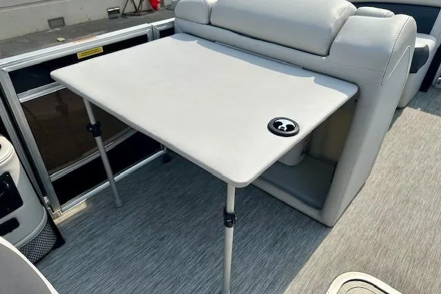 Slide: The Image of 2022 Barletta Corsa 21QC boat interior with table and seating area. - 28