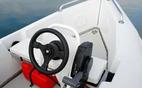 Slide: The Image of 2024 Bullfrog Yacht Tender 10' interior with steering wheel and controls. - 3