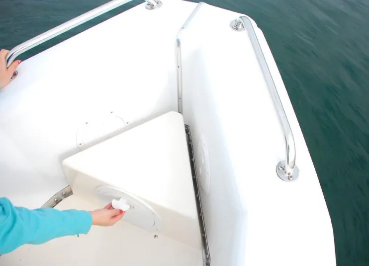 Slide: The Image of Bullfrog Yacht Tender 11.5 (2024) interior with hand accessing storage compartment. - 4