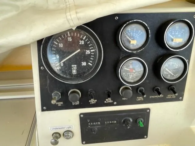 Slide: The Image of Control panel of a 1986 Viking 41 boat with gauges and switches. - 29