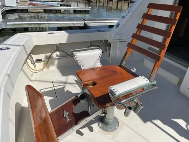 Slide: The Image of 1986 Viking 41 boat with wooden fishing chair on deck. - 33