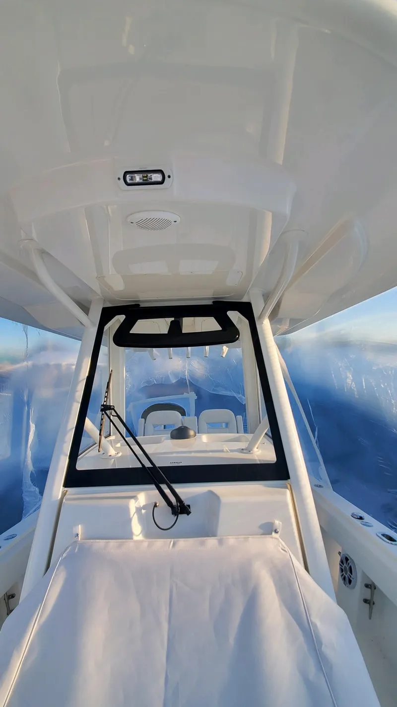 Slide: The Image of 2023 Regulator 28 boat interior with modern helm and seating. - 17