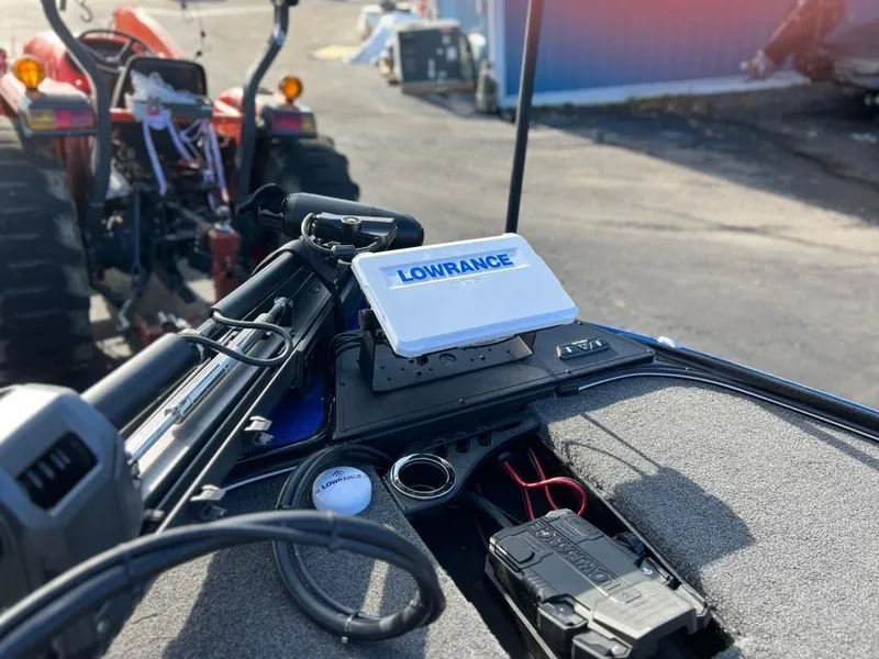 Slide: The Image of Nitro Z20 Pro 2023 boat with Lowrance fish finder and tractor in background. - 11