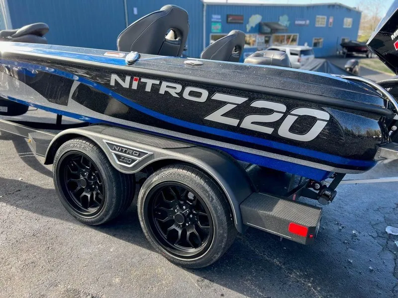 Slide: The Image of 2023 Nitro Z20 Pro boat on a trailer with black wheels. - 4