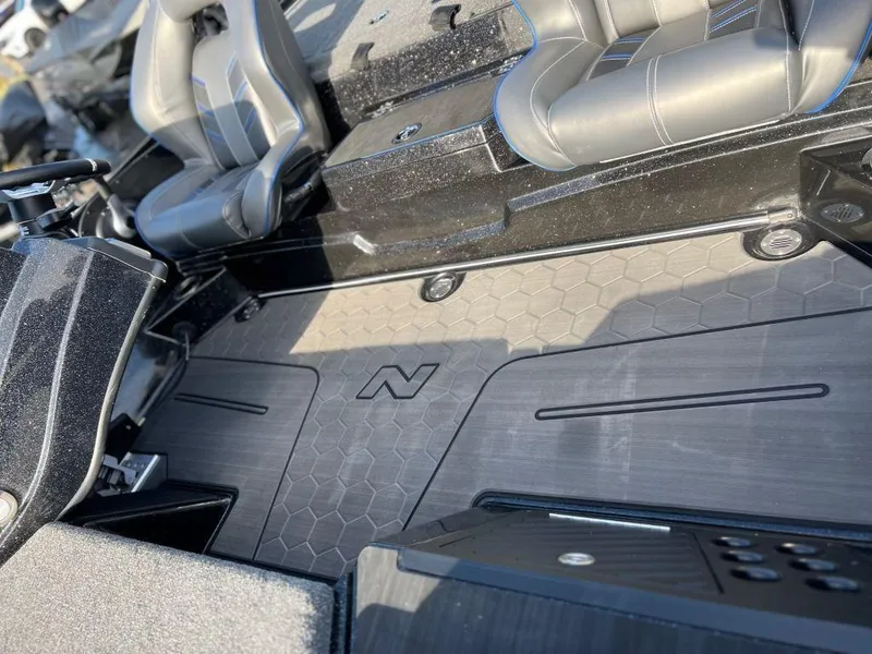 Slide: The Image of 2023 Nitro Z20 Pro boat interior with hexagonal floor pattern and dual seats. - 8
