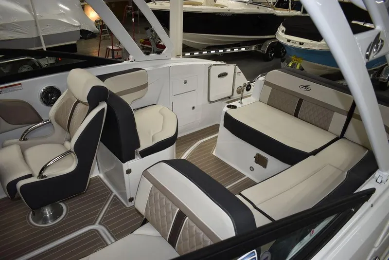 Slide: The Image of 2023 Monterey M6 boat interior with luxurious seating and modern design. - 19