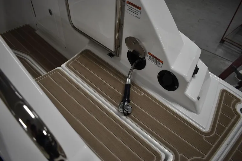 Slide: The Image of 2023 Monterey M6 boat deck with fuel hose and non-slip flooring. - 23