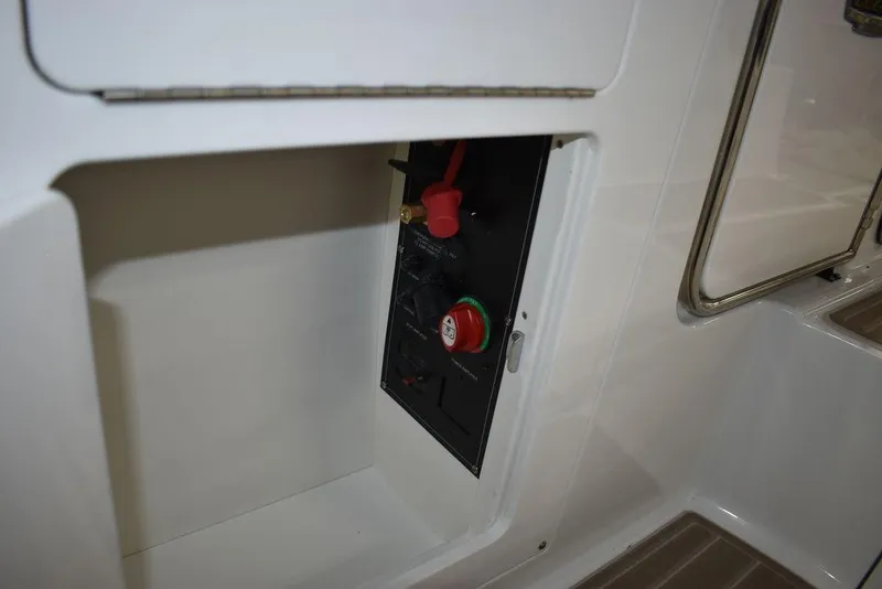 Slide: The Image of 2023 Monterey M6 boat electrical panel compartment. - 30