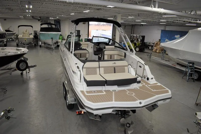 Slide: The Image of 2023 Monterey M6 boat in showroom, rear view, white and beige interior. - 4