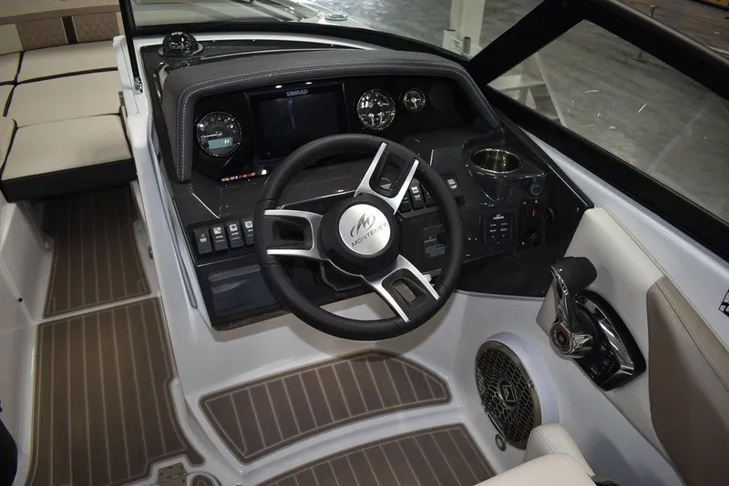 Slide: The Image of 2023 Monterey M6 boat cockpit with steering wheel and control panel. - 42