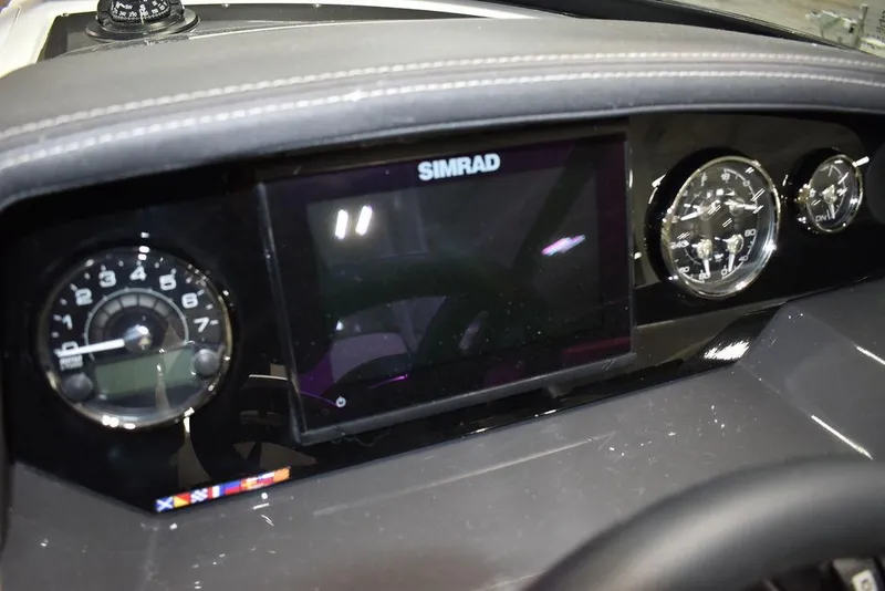 Slide: The Image of 2023 Monterey M6 dashboard with Simrad display and gauges. - 43