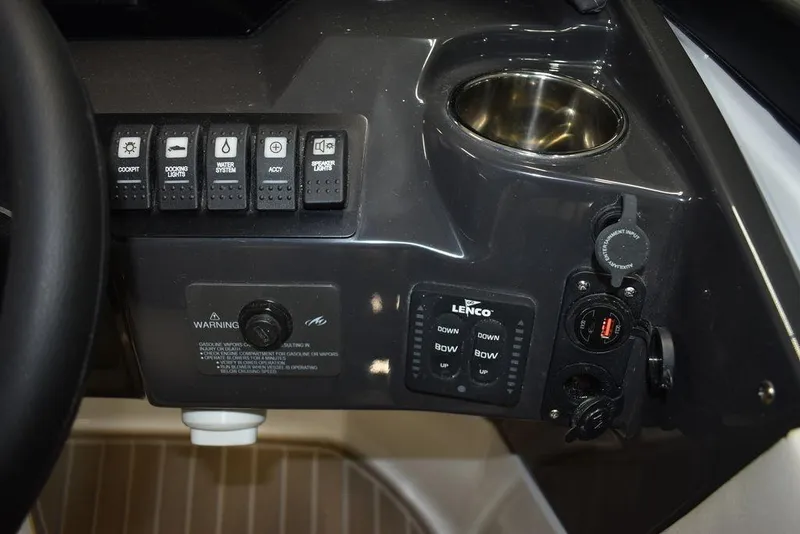 Slide: The Image of Control panel of 2023 Monterey M6 boat with switches and cup holder. - 44