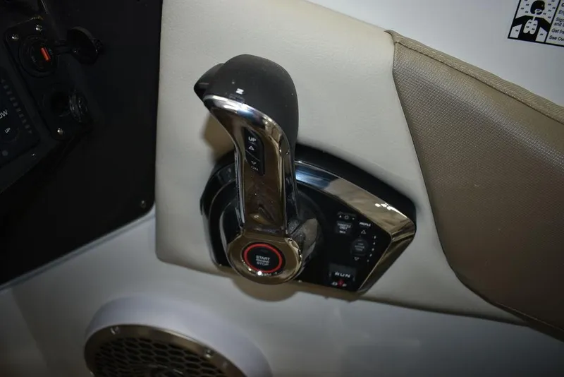 Slide: The Image of 2023 Monterey M6 boat throttle control lever and ignition button. - 46