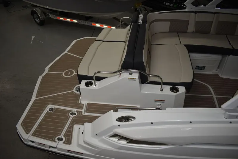 Slide: The Image of 2023 Monterey M6 boat with spacious seating and teak-style deck. - 6