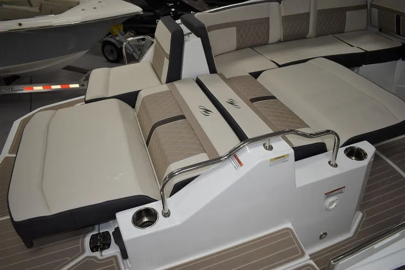 Slide: The Image of 2023 Monterey M6 boat with luxurious seating and cup holders. - 7