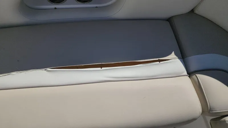 Slide: The Image of Torn seat upholstery on 2017 NauticStar 243DC Sport Deck boat. - 25
