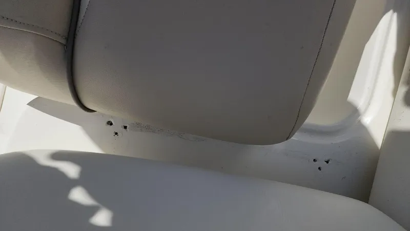 Slide: The Image of Close-up of seat damage on 2017 NauticStar 243DC Sport Deck boat. - 28