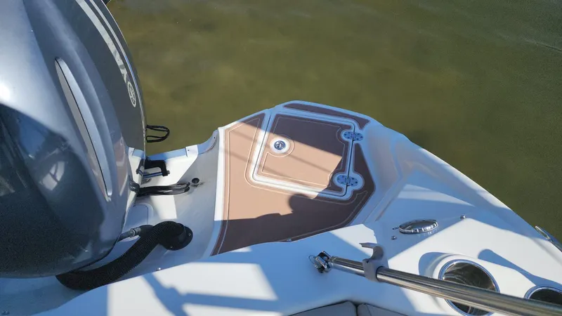 Slide: The Image of 2017 NauticStar 243DC Sport Deck boat stern with outboard motor. - 29