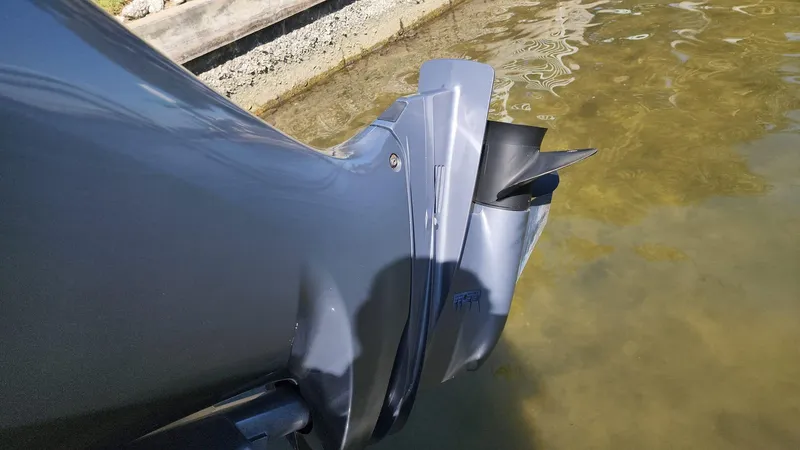Slide: The Image of Close-up of 2017 NauticStar 243DC Sport Deck boat propeller in water. - 31