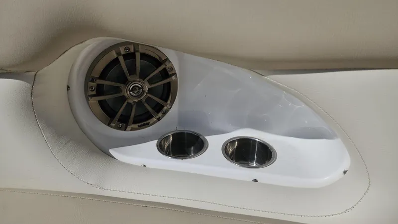 Slide: The Image of 2017 NauticStar 243DC Sport Deck speaker and cup holders. - 35