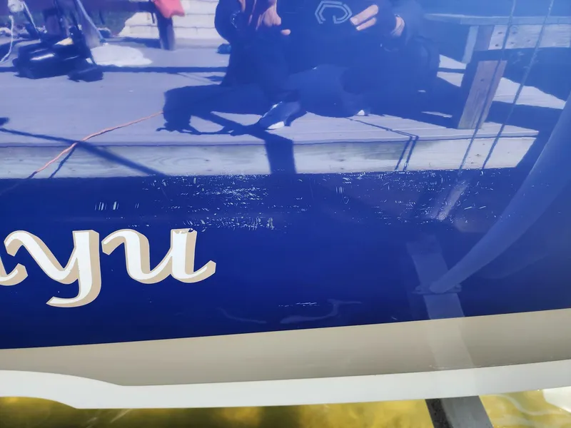 Slide: The Image of Close-up of a 2017 NauticStar 243DC Sport Deck boat hull with partial lettering. - 37