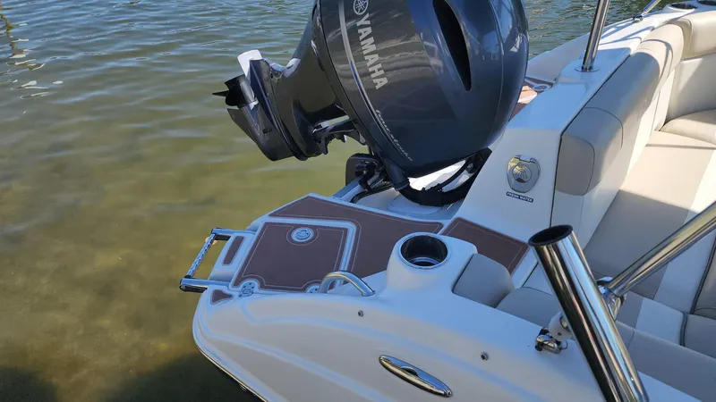 Slide: The Image of 2017 NauticStar 243DC Sport Deck with Yamaha outboard motor in shallow water. - 39