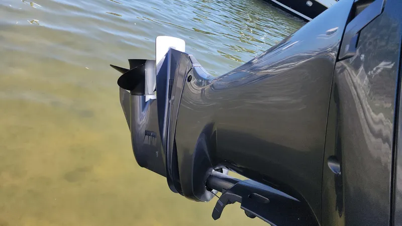 Slide: The Image of Close-up of 2017 NauticStar 243DC Sport Deck outboard motor in water. - 42