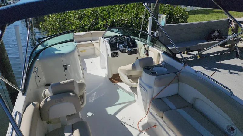 Slide: The Image of 2017 NauticStar 243DC Sport Deck boat interior with seating and steering console. - 48