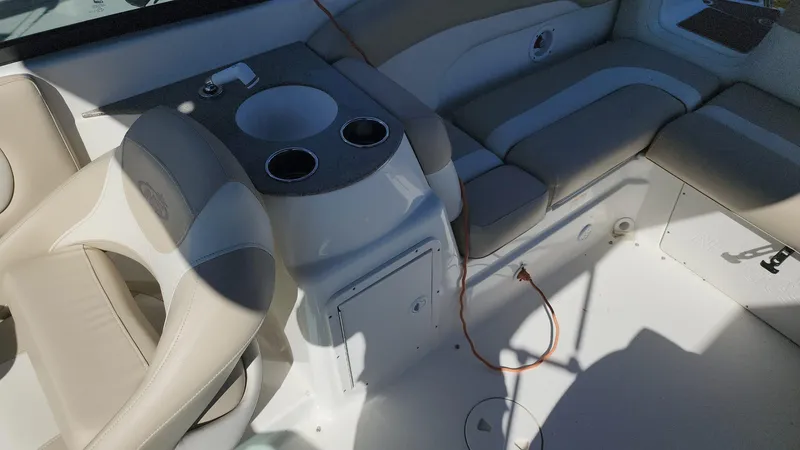 Slide: The Image of 2017 NauticStar 243DC Sport Deck interior with seating and cup holders. - 9