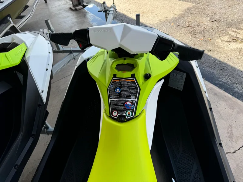 Slide: The Image of 2023 Sea-Doo Spark 2-up Rotax 900 ACE, lime green jet ski, top view. - 4