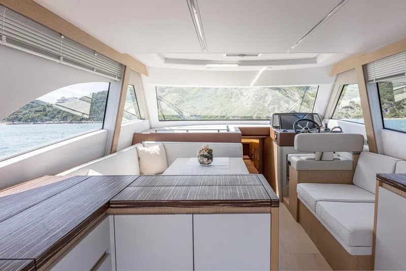 Slide: The Image of Interior of 2024 Solaris Power 48 Flybridge yacht with modern design and scenic views. - 13