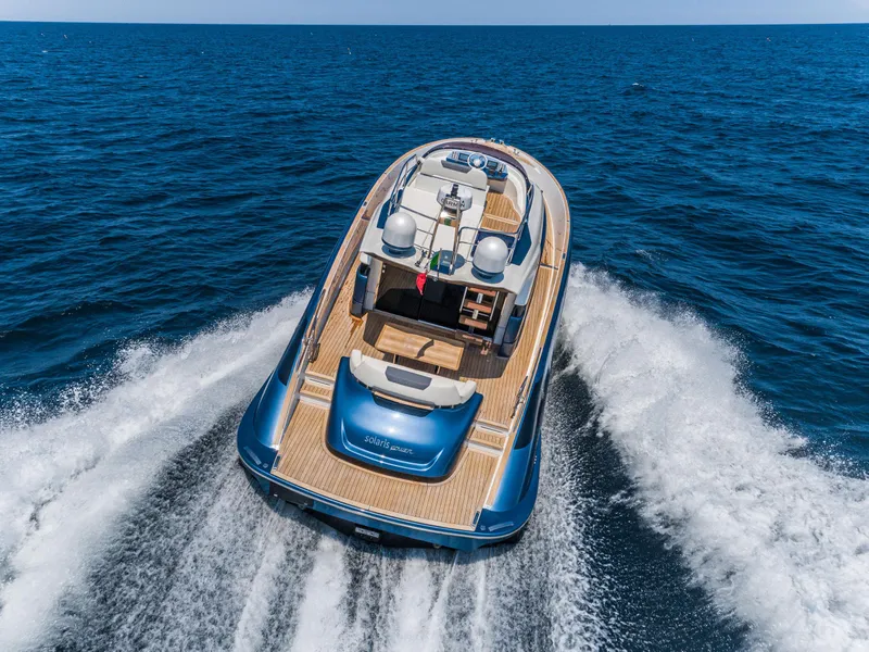 Slide: The Image of 2024 Solaris Power 48 Flybridge yacht cruising on open sea. - 5