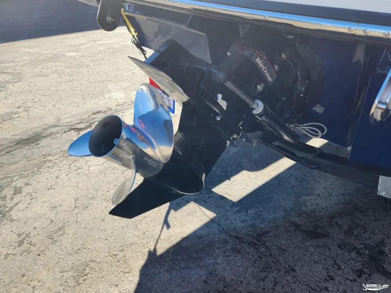Slide: The Image of 2023 Sea Ray SPX 190 boat propeller and outdrive on concrete surface. - 10