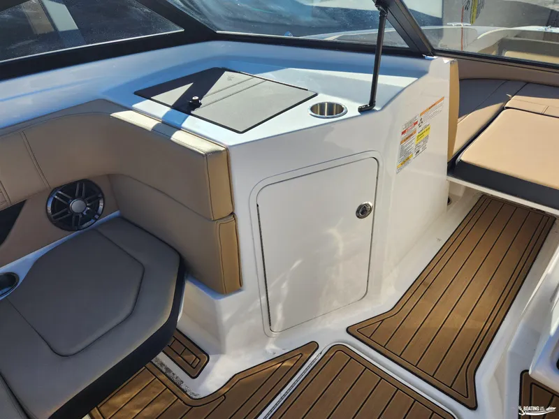 Slide: The Image of 2023 Sea Ray SPX 190 interior with tan seating and wood-style flooring. - 12