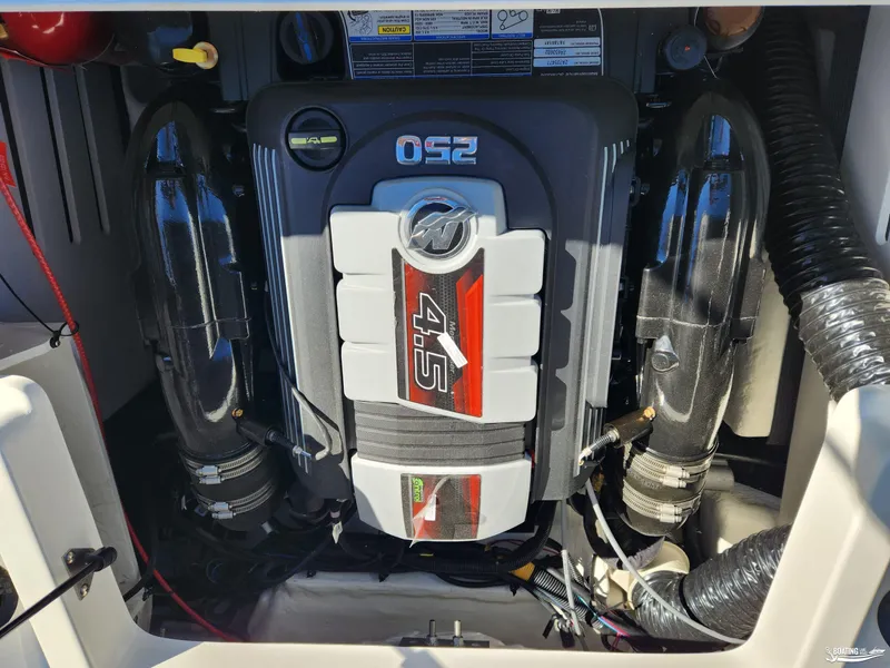 Slide: The Image of 2023 Sea Ray SPX 190 engine compartment showcasing powerful 4.5L engine. - 13