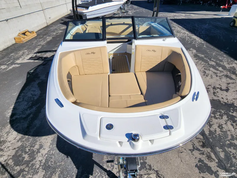 Slide: The Image of 2023 Sea Ray SPX 190 boat with tan interior, docked outdoors. - 7