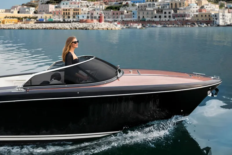 Slide: The Image of 2025 Riva Iseo luxury boat cruising near colorful coastal town - 3