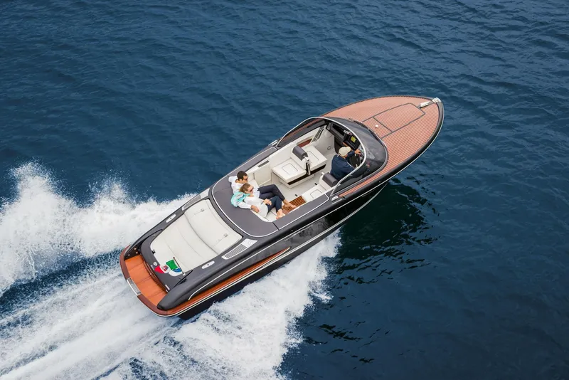 Slide: The Image of Aerial view of 2025 Riva Iseo luxury boat cruising on the water. - 4
