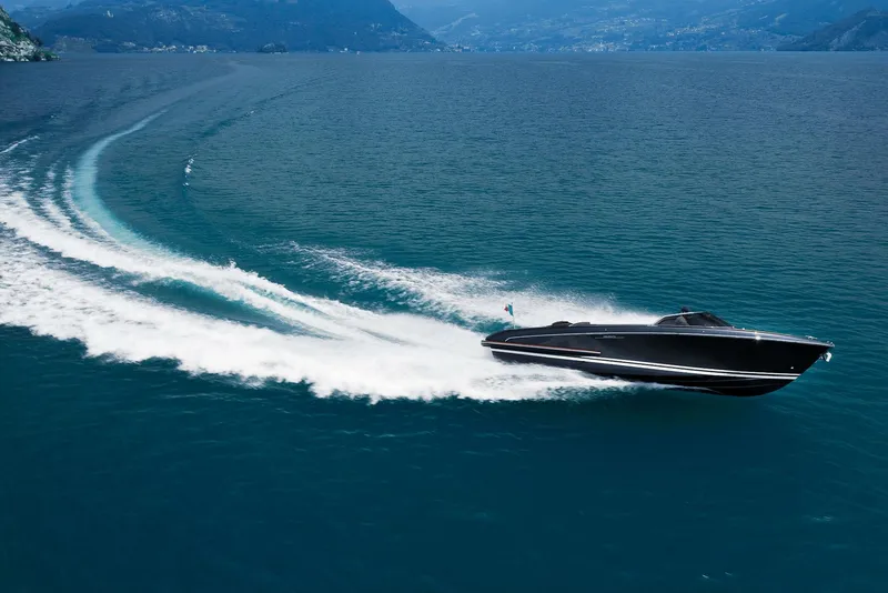 Slide: The Image of 2025 Riva Iseo luxury speedboat cruising on a scenic blue lake. - 5