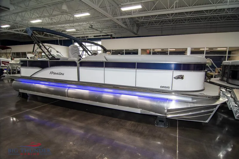 Slide: The Image of 2022 Manitou 25 Oasis SR SHP pontoon boat in showroom. - 0