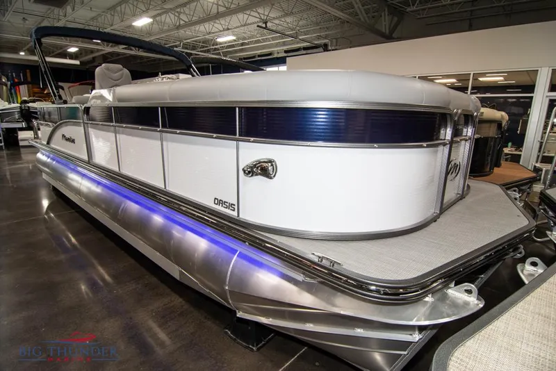 Slide: The Image of 2022 Manitou 25 Oasis SR SHP pontoon boat in showroom. - 1