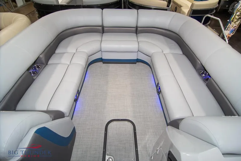 Slide: The Image of 2022 Manitou 25 Oasis SR SHP pontoon boat with spacious seating and LED lighting. - 12