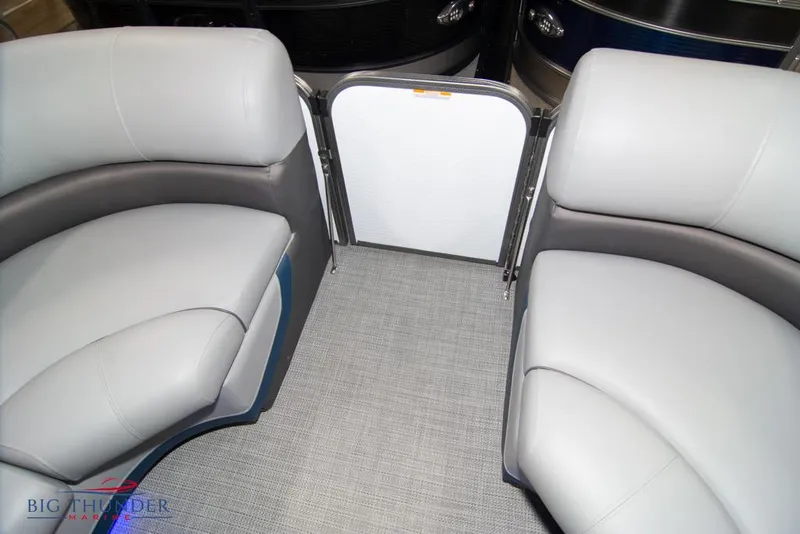 Slide: The Image of 2022 Manitou 25 Oasis SR SHP boat interior seating and gate. - 14
